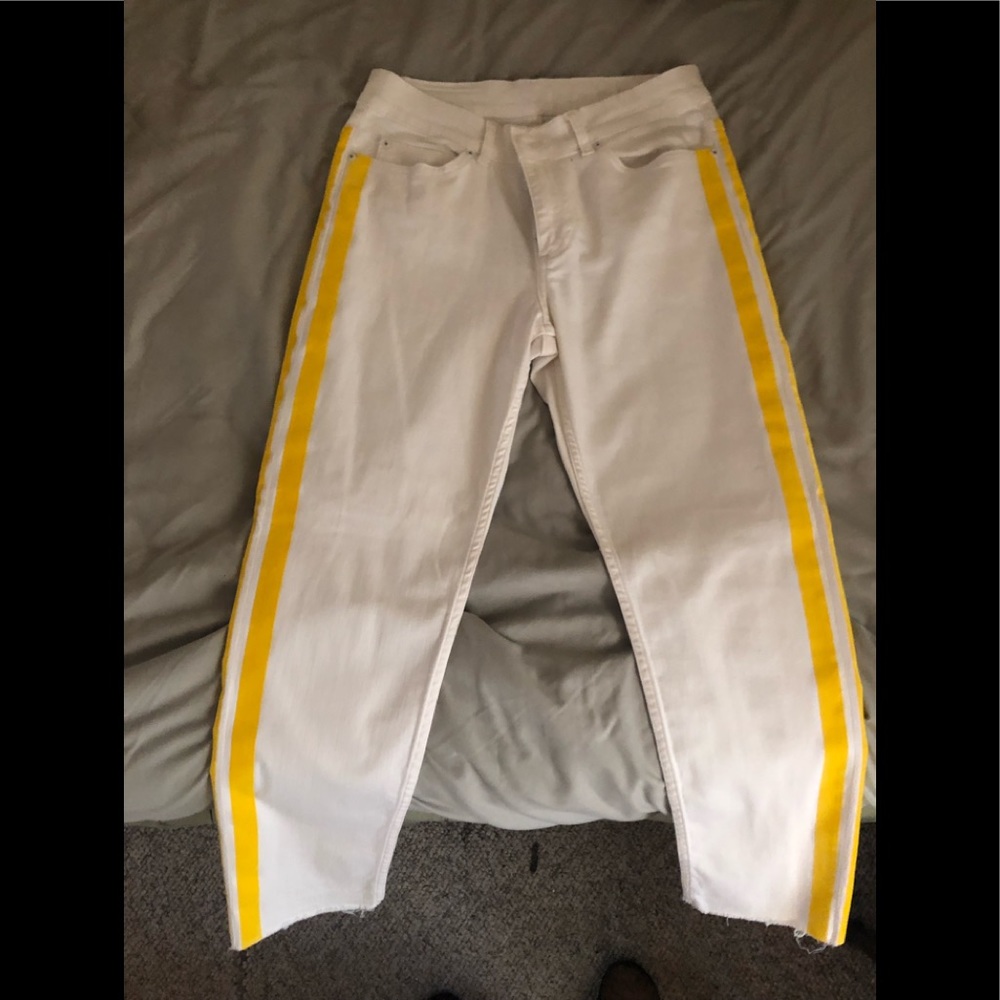 white crop jeans with yellow strip details